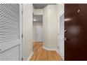 Hallway with wood floors featuring closet doors, and entry doors at 400 W Peachtree Nw St # 3204, Atlanta, GA 30308