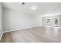 Spacious living room with modern flooring, neutral walls, and ample natural light at 1241 To Lani Path, Stone Mountain, GA 30083