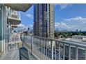 Condo balcony view featuring city views, modern railings, and multiple high rise buildings at 361 17Th Nw St # 1021, Atlanta, GA 30363