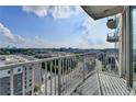 Sunny balcony view with modern railings, featuring the city and its multiple buildings at 361 17Th Nw St # 1021, Atlanta, GA 30363