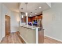 Contemporary kitchen features wood cabinets, stainless steel appliances, and an island with granite countertop at 361 17Th Nw St # 1021, Atlanta, GA 30363