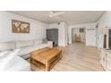 Bright living room featuring a comfortable sectional, light wood floors, and modern decor at 3529 Essex Ave # 75, Atlanta, GA 30339