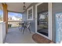 Welcoming front porch with an outdoor seating area, charming decor, and a view of the neighborhood at 1146 Sims Sw St, Atlanta, GA 30310