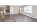 Spacious living room features modern gray flooring and plenty of natural light at 1722 Johnston Nw Trl, Kennesaw, GA 30152