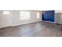 Large, open-concept living area with modern flooring and stylish design at 1722 Johnston Nw Trl, Kennesaw, GA 30152