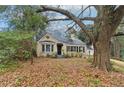 Charming, one-story brick home with bay window, chimney, black shutters and an inviting front entrance at 1815 Monroe Ne Dr, Atlanta, GA 30324