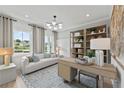 Bright, stylish office with modern lighting, elegant shelving, and comfortable seating; perfect for productivity at 628 Topsail Drive Pkwy, Villa Rica, GA 30180