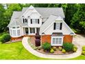Beautiful home featuring a landscaped yard, brick accents, and a welcoming entrance at 2003 Hubbard Ct, Villa Rica, GA 30180