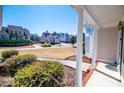 Inviting front porch view showcasing the neighborhood and well-kept landscaping at 2003 Hubbard Ct, Villa Rica, GA 30180