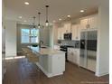 Spacious kitchen with island, stainless steel appliances, and pendant lighting at 1915 Cassia Aly, Kennesaw, GA 30144