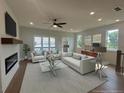 Bright living room with fireplace, large windows, and stylish decor at 1915 Cassia Aly, Kennesaw, GA 30144