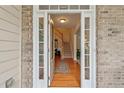 View of the foyer featuring hardwood floors, staircase, and an open layout at 1312 Preserve Park Dr, Loganville, GA 30052