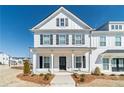 Charming two-story home with black shutters, white siding, and inviting front porch at 1703 Prospect Way, Conyers, GA 30094