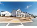 Street view of a row of charming two-story homes with black shutters and white siding at 1703 Prospect Way, Conyers, GA 30094