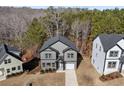An aerial view of the home, showing the layout and its positioning on the landscaped lot and driveway at 3195 Tackett Rd, Douglasville, GA 30135