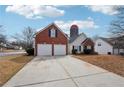 A charming home features a two-car garage and silo-inspired architecture at 10 Dairyland Dr, Covington, GA 30016