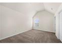 Bright bedroom features neutral walls and plush carpeting, offering a serene and comfortable atmosphere at 3492 Maple Hill Rd, Lithonia, GA 30038