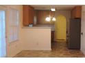 Eat-in kitchen dining area with wood cabinets and stainless steel refrigerator at 4728 Sedum Way, Atlanta, GA 30349