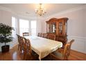 Formal dining room featuring a large table, china cabinet, and bay window at 3405 Lake Valley Way, Douglasville, GA 30135