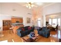 Open-concept living room with hardwood floors, high ceilings, and elegant furnishings at 3405 Lake Valley Way, Douglasville, GA 30135