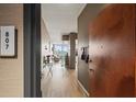 Inviting apartment entryway with wood floors and a view to the open concept living space at 361 17Th Nw St # 807, Atlanta, GA 30363