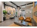 A stylish building lobby with modern furniture and interesting art pieces at 361 17Th Nw St # 807, Atlanta, GA 30363