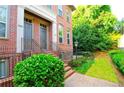 Close up of a stately red brick home with an inviting front entrance and well-maintained lawn at 2428 Crescent Park Ct, Atlanta, GA 30339