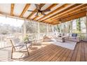 Relaxing covered porch featuring wood ceiling, ceiling fans, and comfortable seating, great for outdoor living at 134 Turman Se Ave, Atlanta, GA 30315