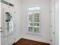 Bright entryway with hardwood floors, white trim, and a window for natural light at 2752 Middlecreek Way, Cumming, GA 30041