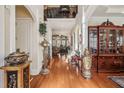 Elegant foyer with hardwood floors, staircase with iron railings, and views of the upper level at 891 Legacy Woods Dr, Norcross, GA 30093