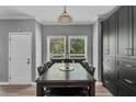 Dining room with a large window and views of the surrounding greenery at 4668 Raiders Ridge Ct, Lithonia, GA 30038