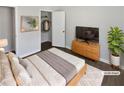 Well-lit bedroom featuring closet, wood-look flooring, with complementary decor at 4673 Hairston Crossing Way, Stone Mountain, GA 30083