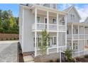 Side view of a charming two-story home with a double front porch and inviting entryway at 2140 Parkside Ln, Roswell, GA 30076
