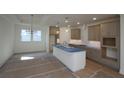 Modern kitchen boasts an island, updated cabinets, and ample counter space at 2040 Ripple Park Bnd, Canton, GA 30114