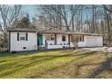 Charming single-story home featuring a bright teal front door and well-maintained front yard at 2283 Noahs Ark Rd, Jonesboro, GA 30236