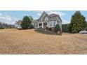 Attractive home with a stone facade, manicured lawn, and lovely landscaping, creating a welcoming curb appeal at 4740 Arbor Meadows Dr, Cumming, GA 30040