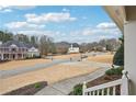 Scenic neighborhood view from the porch, showcasing well-maintained lawns, mature trees, and peaceful residential streets at 4740 Arbor Meadows Dr, Cumming, GA 30040