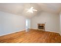 Living room with hardwood floors, vaulted ceiling and stone fireplace at 218 Pine Needle Trl, Villa Rica, GA 30180