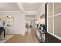 Bright entryway with hardwood floors, modern decor, and an inviting view into the home at 2201 Cormac St, East Point, GA 30344