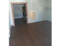 Living room with laminate floors and an open doorway leading to kitchen at 550 Lake Dr, Hapeville, GA 30354