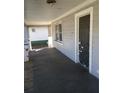 Spacious covered porch with natural light filtering in from surrounding greenery at 550 Lake Dr, Hapeville, GA 30354