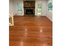 Living room featuring a stone fireplace and hardwood floors at 1173 Mill Ridge Dr, Lawrenceville, GA 30045