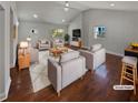Bright living room with vaulted ceilings, a white brick fireplace, and modern decor at 2548 Loghaven Nw Dr, Atlanta, GA 30318