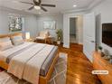 Inviting main bedroom featuring hardwood floors and a large window at 2548 Loghaven Nw Dr, Atlanta, GA 30318