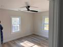 Bright bedroom with stylish flooring, a ceiling fan, and natural light from large windows at 1400 Bouldercrest Rd, Atlanta, GA 30316