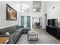 Bright living room boasts soaring ceilings, large windows, and modern furnishings at 2304 Stancrest Ln, Lawrenceville, GA 30044