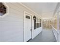 View of covered front porch featuring a stylish front door with glass accents at 100 Nottingham Dr, Douglasville, GA 30134