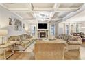 Inviting living room with coffered ceilings, stone fireplace, and hardwood floors at 2695 Ridge Manor Drive, Dacula, GA 30019