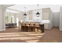 Beautiful kitchen island with bar stool seating and pendant lighting at 6206 Cedarcrest Nw Rd, Acworth, GA 30101