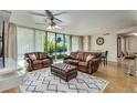 Spacious living room filled with natural light from the large windows at 700 Park Regency Ne Pl # 603, Atlanta, GA 30326
